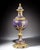 A striking and monumental covered vase, executed in the celebrated Sèvres taste, distinguished by its deep cobalt blue...