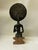 Bring a powerful piece of West African heritage and artistry into your space with this striking, vintage mid-20th-century...