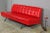 1970s Pirelli red imitation leather sofa bed with black iron structure and backrest with buttons. removable seat