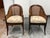 Design Plus Gallery presents a Pair of Mahogany Bergère Chairs in Regency Styling. The chairs have caned backs and sides...