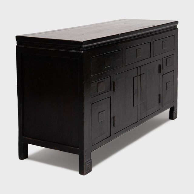 This antique Chinese coffer from the turn of the century is crafted in the geometric style of Tianjin cabinetry, faced...
