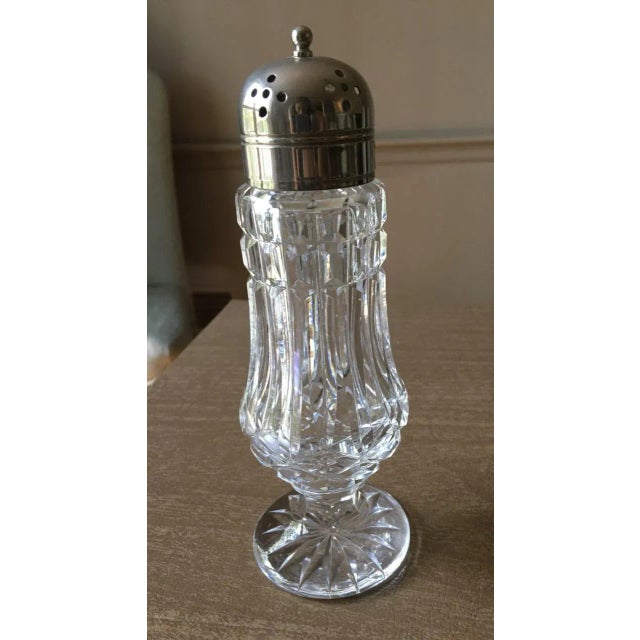 A single, vintage Waterford Crystal shaker. The piece could be used for salt or spices, but I believe that the shaker is...