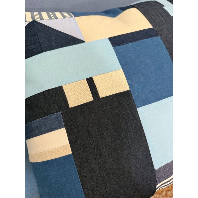 The placement of geometric fabric shapes began as a free-form, intuitive exploration when I started to create this pillow....