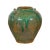 A Chinese Qing Dynasty period green glaze jar from the 19th century with dripping effects and petite loop handles....