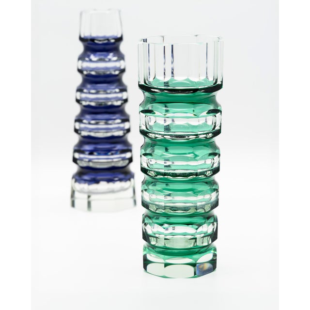 A sculptural pair of heavy crystal block vases produced by veb ilm-kristall in ilmenau, east germany, during the 1970s....