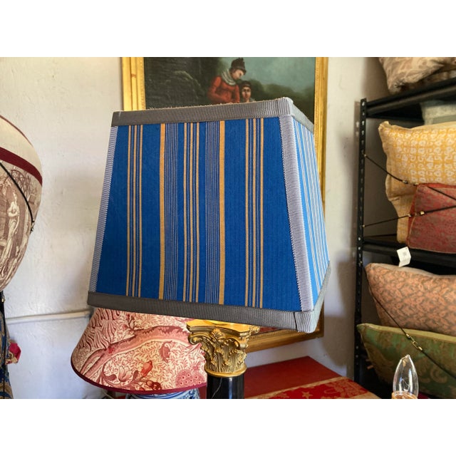 A square lampshade handmade with antique French ticking stripe. Measurements: top 7” Bottom 9” side8” 2 available
