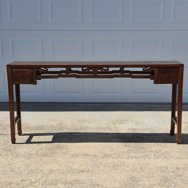 This is a striking Asian style carved elm wood altar table or console table that measures 74.5” long, 13.25” deep, and...
