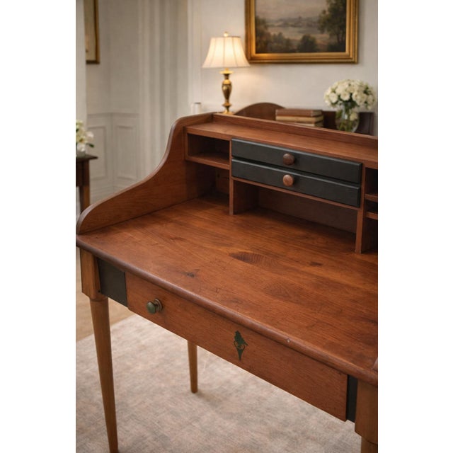 This early 20th century Yield House writing desk is a beautifully preserved example of Early American and primitive-...