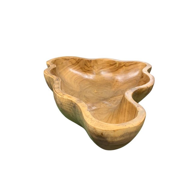 This teak live edge bowl is a unique piece showcasing the natural beauty of teak wood. Crafted by skilled artisans, its...