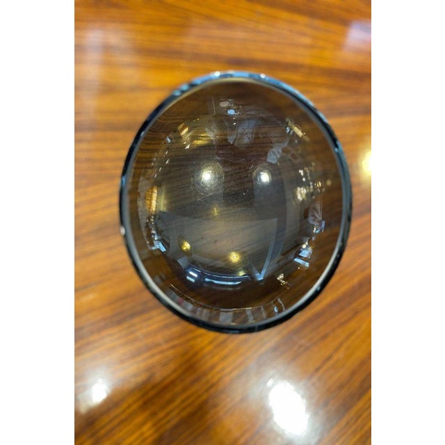 Smoked glass catchall tray with a thickness of 1 cm. The piece features a design with two different heights: a higher...