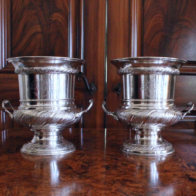 A very handsome pair of silver plate Champagne coolers, with great details and the classic Campagna urn form. These pieces...