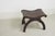 Spanish Revival vintage stool featuring a dark wood frame, hand-woven leather strap seat finished with studs. One...