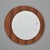Found in Italy, this wall mirror dates from the late 1960s / early 1970s. Round mirror is mounted, off-center, on larger...