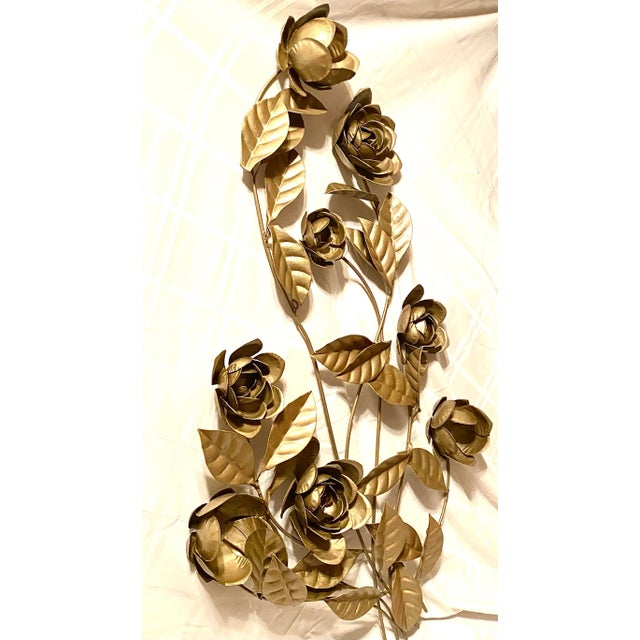 Striking metal wall sculpture featuring roses and leaves in a beautiful gold finish. Note the large size of this classic...