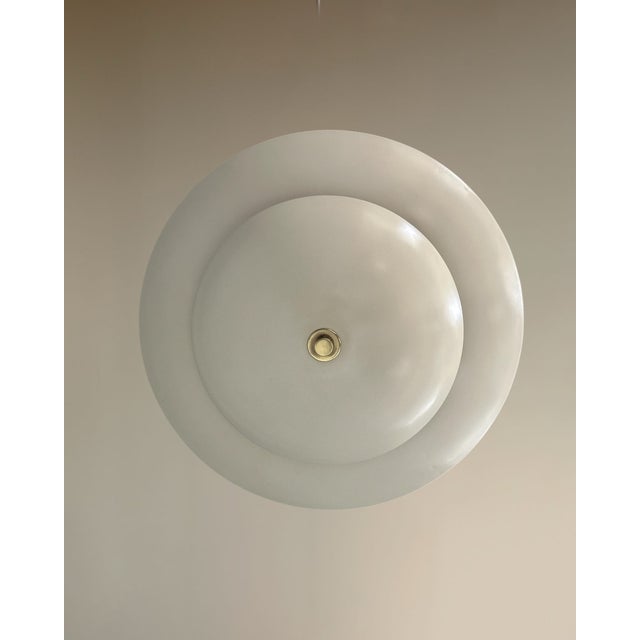 Illuminate your space in style with this stunning 4-light pearl brass pendant light. Featuring an exquisite antique brass...