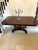 An antique William IV English figured mahogany pedestal dining table of exceptional quality featuring a solid tilt top and...