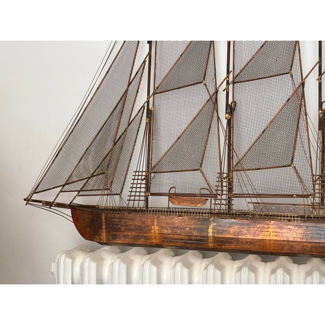 1975 copper sculpture of a sailing ship or schooner, signed C. Jeré for Curtis Jeré, the nom de plume of the company...