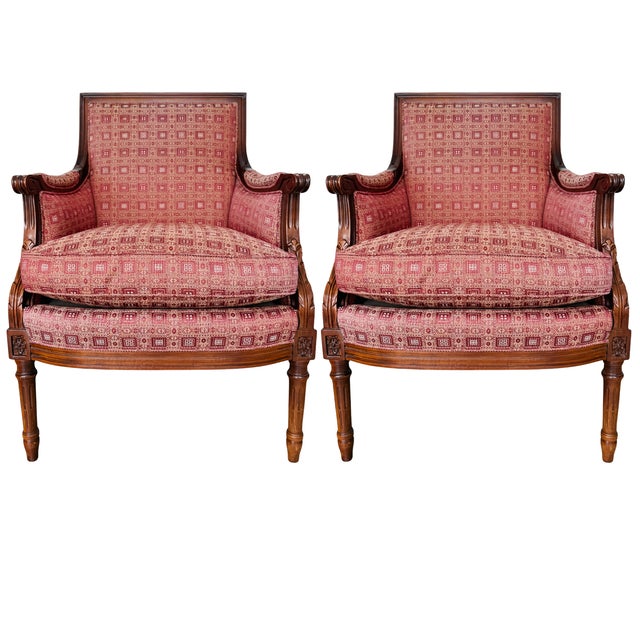 This exceptional pair of Louis XVI Neoclassical style bergère armchairs by Hancock & Moore showcases the refined symmetry...