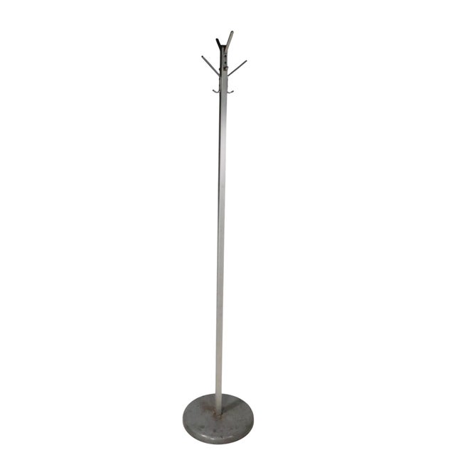 Industrial coat tree, rack having four arms each with two hooks. The squared vertical post and hooks are constructed of...