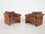 About this item Set of two teak lounge chairs and ottoman, with brown leather cushions. The leather has gained a nice...