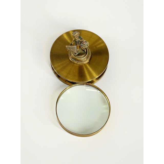 Vintage brass desk magnifying glass paper weight. The magnifying glass works well and slides easily. The romantic Romeo...