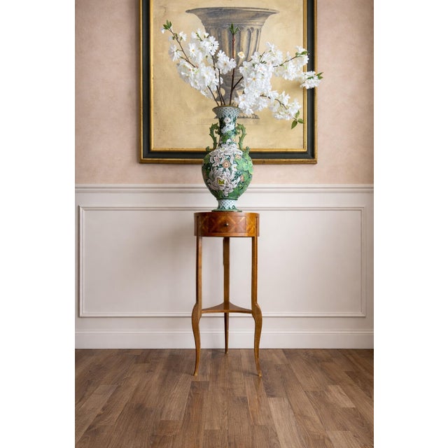 A beautifully crafted antique occasional table, likely French, showcasing refined proportions and elegant craftsmanship....