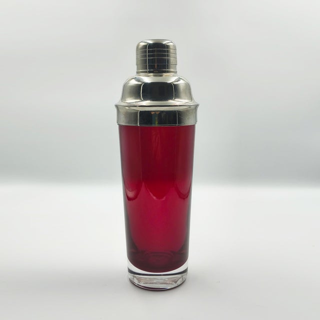 An exceptional mid-century modern italian cocktail shaker from the 1960s, featuring a striking, vibrant ruby red glass...