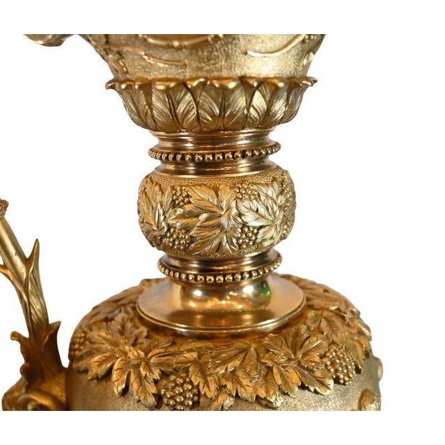 Magnificent pair of French gilt bronze ewers dating to the mid 19th century Of impressive baluster form with richly...