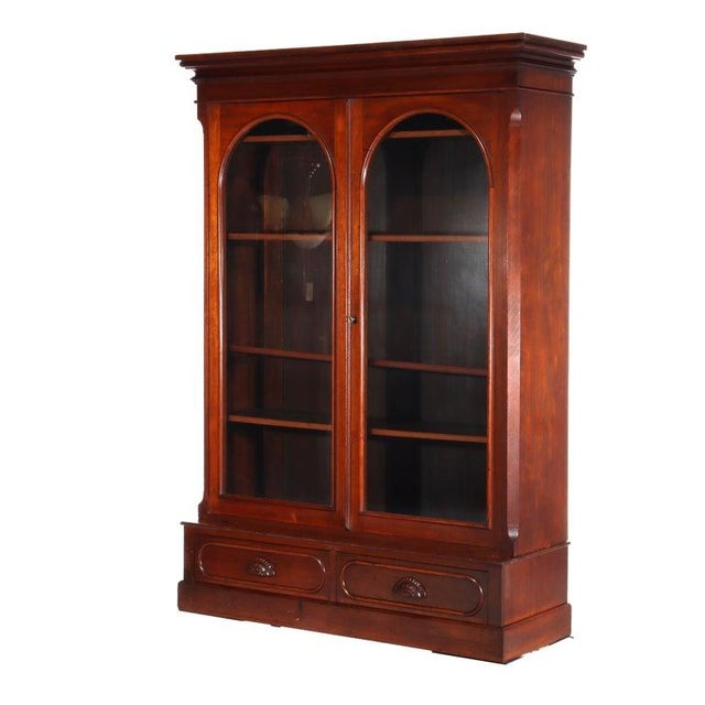 Oversized antique Victorian walnut bookcase with 2 arche-front doors over 2 lower dawers c1890 Measures - 79 3/4" x 54...