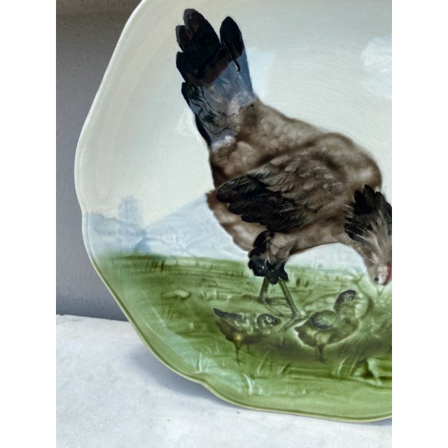 Majolica plate with hen and chicks signed Hippolyte Boulenger Choisy le Roi, circa 1890. The manufacture of Choisy le Roi...