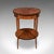This is an antique two tier occasional table. A French, Kingwood and marquetry lamp table or jardiniere stand, dating to...