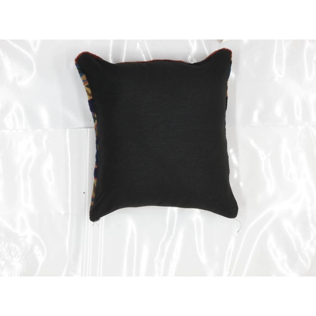 Pillow with genuine hand made antique Persian rug fragment, poly fill, fabric backing with sewn closure.