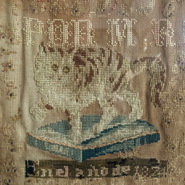 1824 needlework “sampler” with typical alphabet and numerical themes, but AWESOMELY has various animals (parrot, cat,...