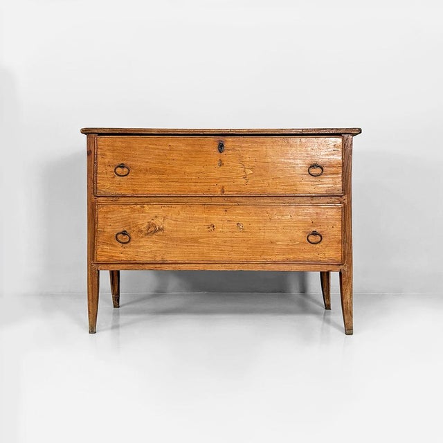 Rustic wall chest of drawers in solid wood, crafted in an 18th-century style and dating to approximately the 1930s....