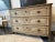 1800s Antique French Bleached Commode with beautiful detailing! The piece features two front cabriole legs, detailed...