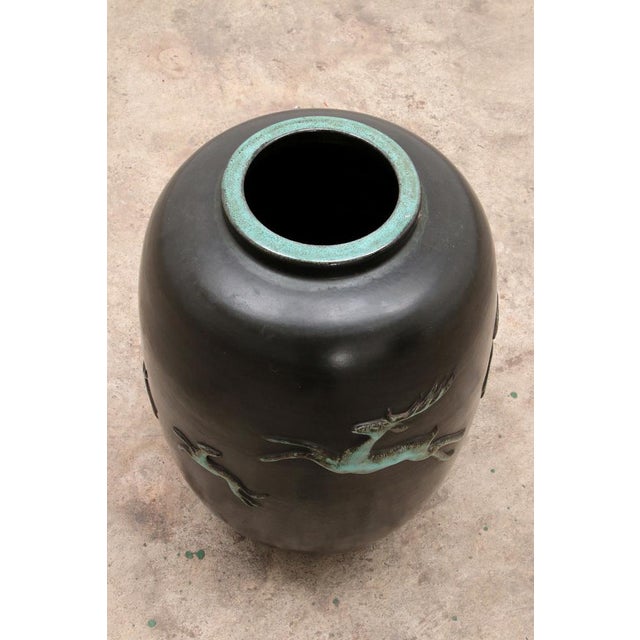 Large glazed black-green terracotta vase from the 1950s with deer in bas-relief made by Ugo Zaccagnini & Son.s. Beautiful,...