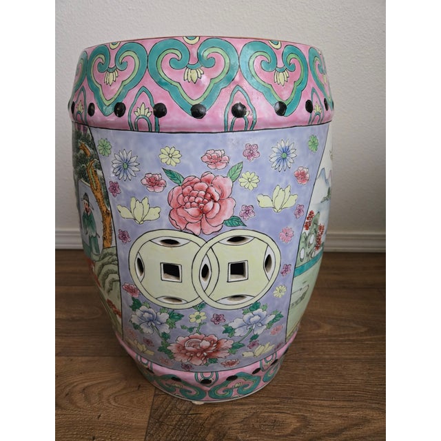 This vintage Chinese porcelain garden stool features a traditional drum-form silhouette with hand-painted floral and...