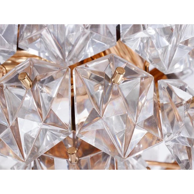 Elegant flush mount chandelier with faceted crystals mounted on gold plated brass frame. With this light you make a clear...