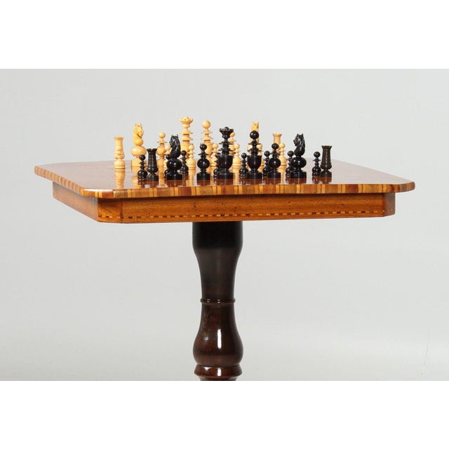 Antique chess table italy (sorrento) walnut, etc. late 19th century dimensions: h x w x d: 71 x 50 x 50 cm this richly...