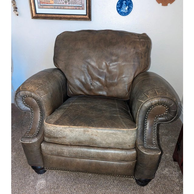 The first edition, purchased in the '90s It has a. vintage patina that can't be purchased. It is a Barcalounger that is...