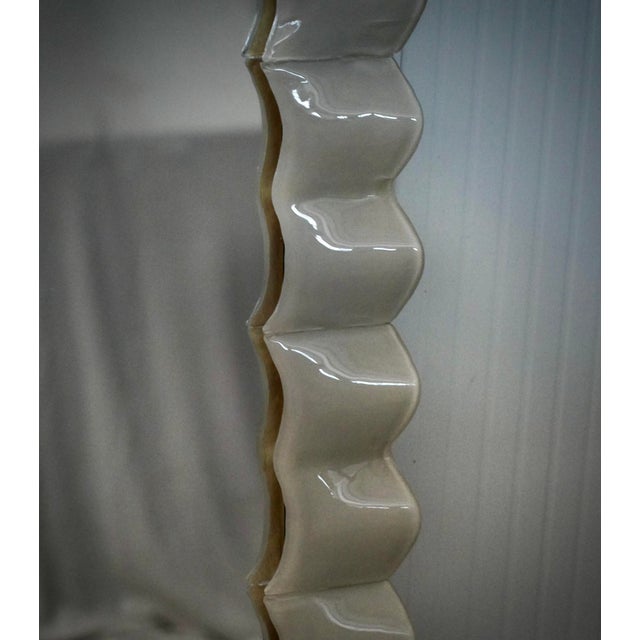 A stunning, cream-colored Murano glass mirror. A mirror that will adorn your home on its own. Rich yet tasteful, the...