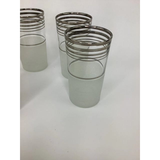 Vintage Art Deco Cocktail Set with Pitcher, Large Shaker, and 6 Highball Glasses. Each piece has silver bands on clear...