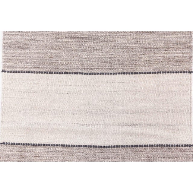 An expression of understated elegance and craftsmanship, this Contemporary Flat Weave Runner seamlessly merges form and...