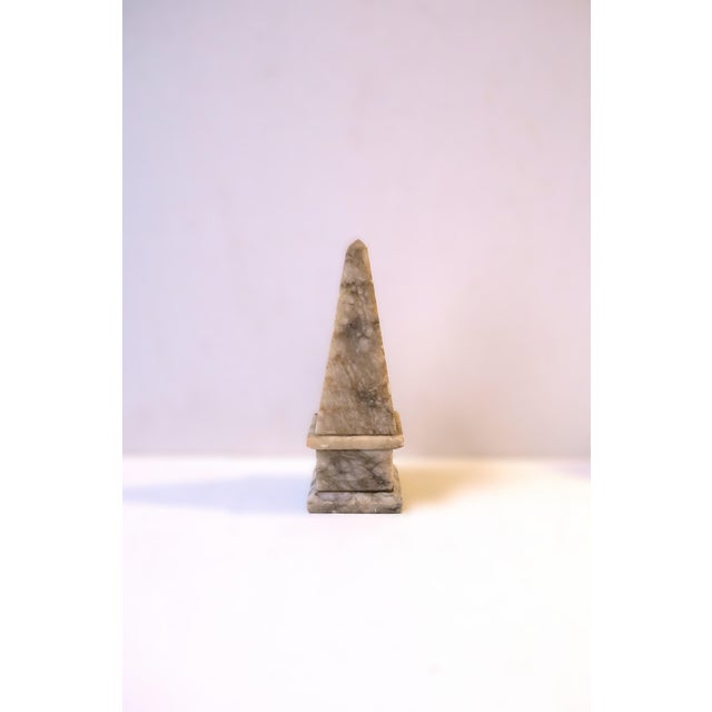 An Italian alabaster marble Obelisk decorative object, in the Modern style, circa early to mid-20th century, Italy....