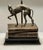 For your consideration. . . A beautiful vintage bronze Whippet/Greyhound standing on top of a stack of faux books with a...