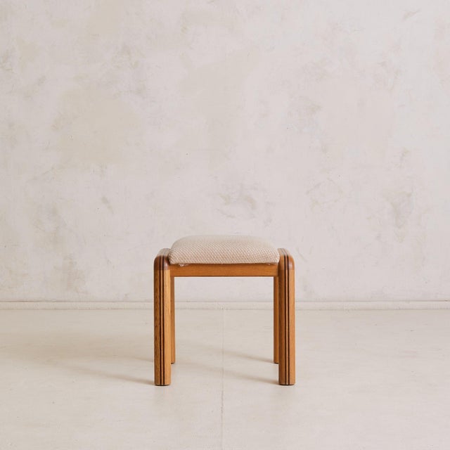 Handmade in France in the 1960s, this oak vanity stool is defined by soft corners and subtle detail. Rounded legs curve...