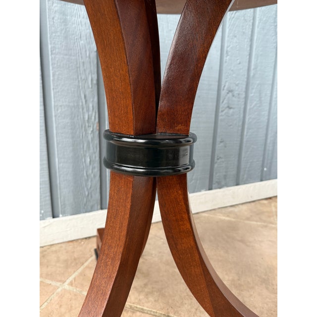 High end 20th century round occasional table with a pedestal base attributed to Dessin Fournir. Although the label is...