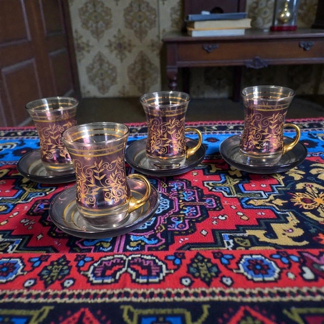 This Vintage Turkish Tea Cup Set for Four features elegant purple and gold gilded glass cups inspired by Turkish design....