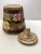 A charming mid century rustic cookie jar in the form of an old fashioned churn with a pair of pastel flowers, covered in a...