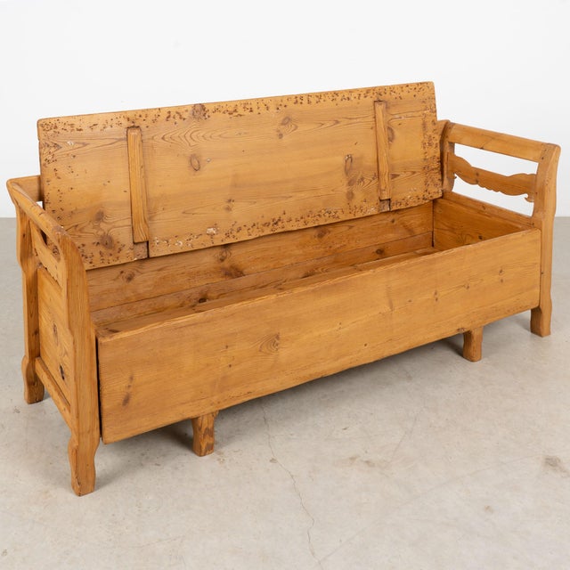 19th century Swedish bench, crafted in pine with a warm aged patina enhanced by a waxed finish. Simple carved details...